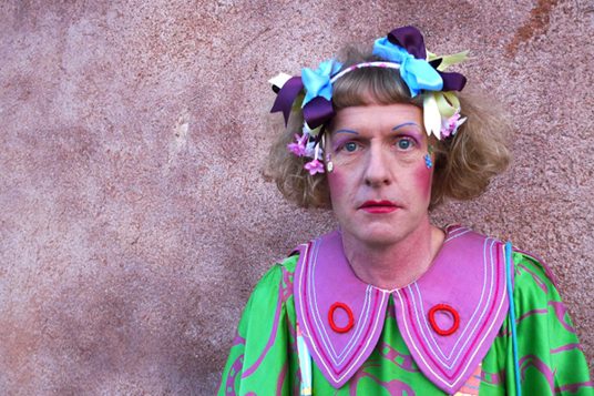 Photograph of artist, Grayson Perry in bright colours