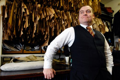 Photograph of Soho Tailor with patterns behind
