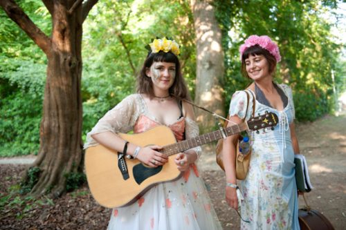 Two musicians with a guitar